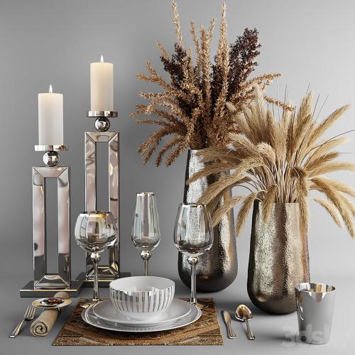 Decorative set with dishes and bouquets of dry grass