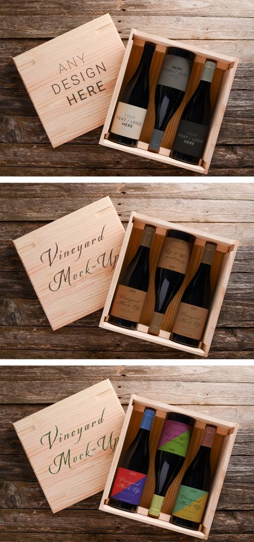 3 Red Wine Bottles in a Wood Crate on a Wooden Background - 475600835
