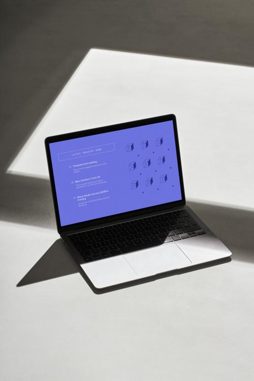Laptop with Hard Shadows on a Grey Floor - 478873558