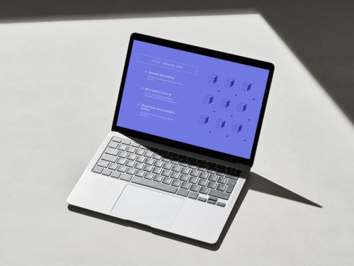 Laptop on a Concrete Surface with Shadows - 478873568