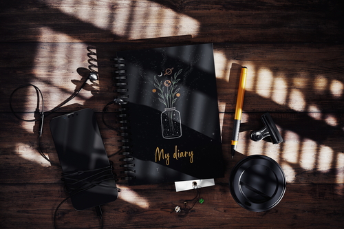 Spiral Notebook On Wooden Surface With Hard Shadow Mockup
