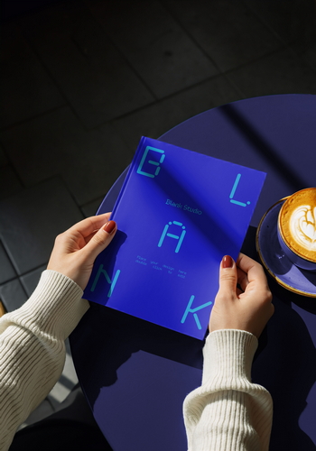 Hardcover Book in Hand Mockup