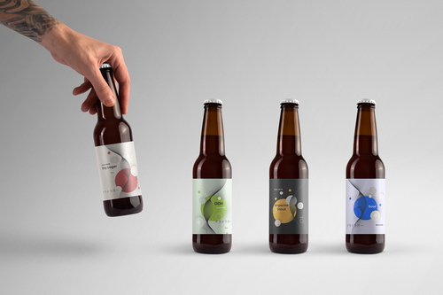 Hand Holding Glass Bottle Mockup Scene 28