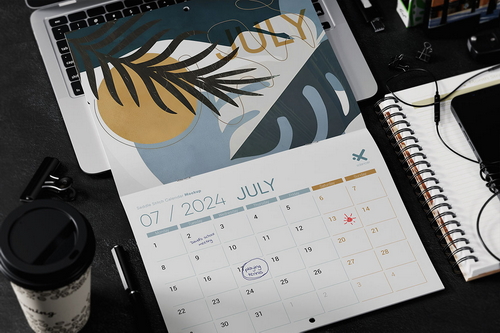 Saddle Stitch Calendar on Laptop Mockup