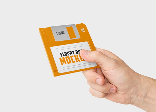 Hand Holding Floppy Disk Mockup