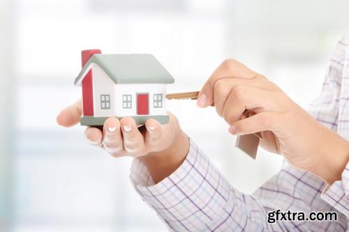 Real Estate Agent with House Model & Keys 30xJPG Real Estate Agent with House Model & Keys 30xJPG