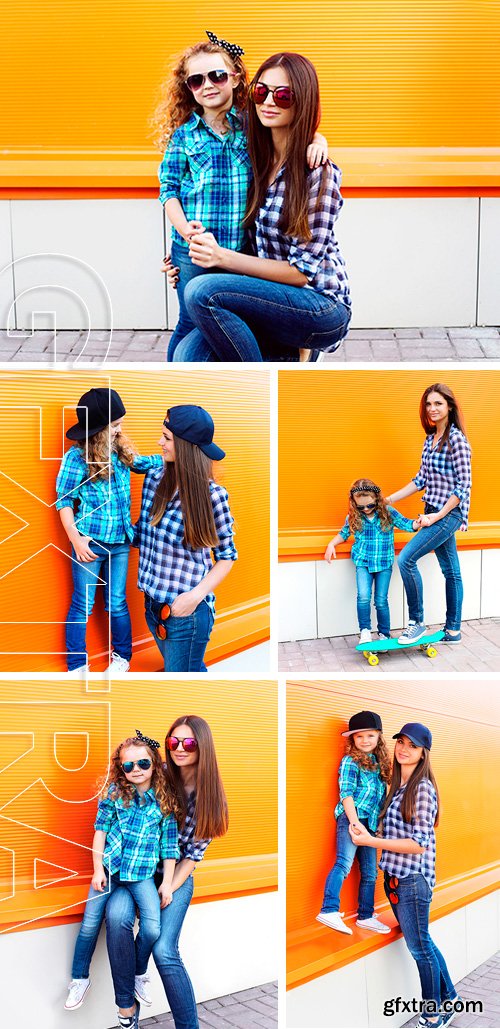 Stock Photos - Fashion family concept - mother and child wear a checkered shirts and sunglasses in the city together against the colorful wall