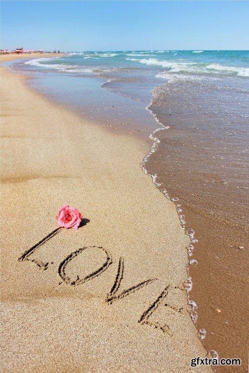 Flower and writing on the sand