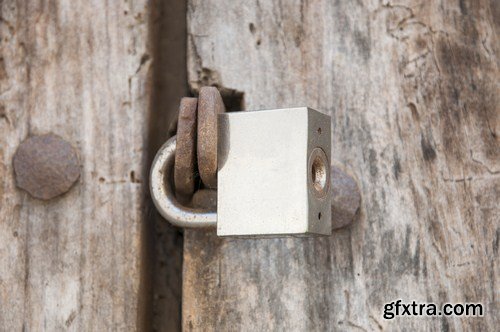 Old rusty padlock on wooden door 15X JPEG