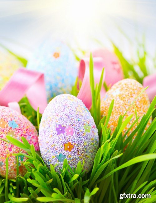 Easter background, beautiful colorful eggs in spring grass