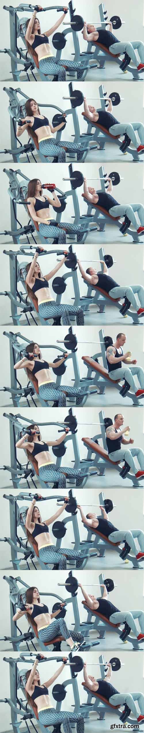 Brunette sportswoman and muscular man doing chest exercise Brunette sportswoman and muscular man doing chest exercise