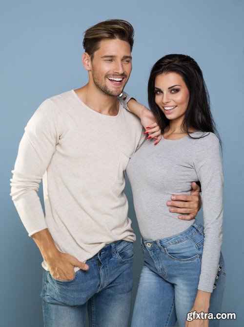 Portrait of smiling beautiful couple, man and woman in jeans