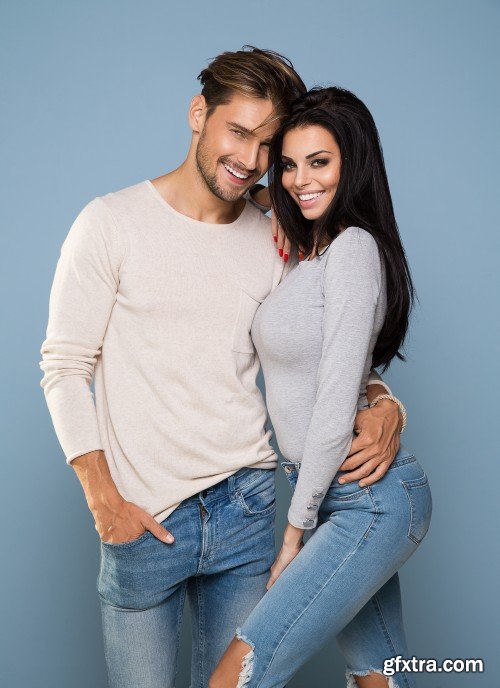 Portrait of smiling beautiful couple, man and woman in jeans