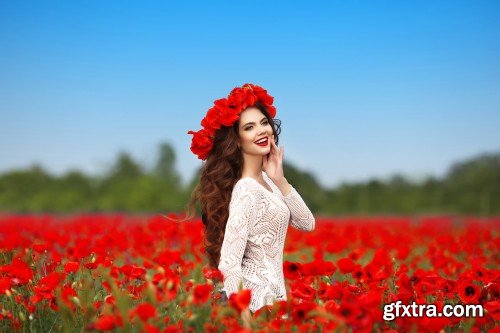 Fashion model girl portrait with red roses and red poppies