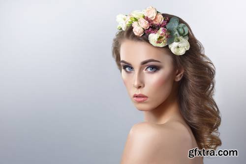 Delicate Spring Beauty Portrait of a Beautiful Girl with a Wreath of Flowers on His Head Isolated