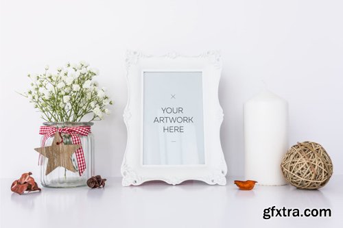 White Frame Mockup With Candle &amp; Flowers
