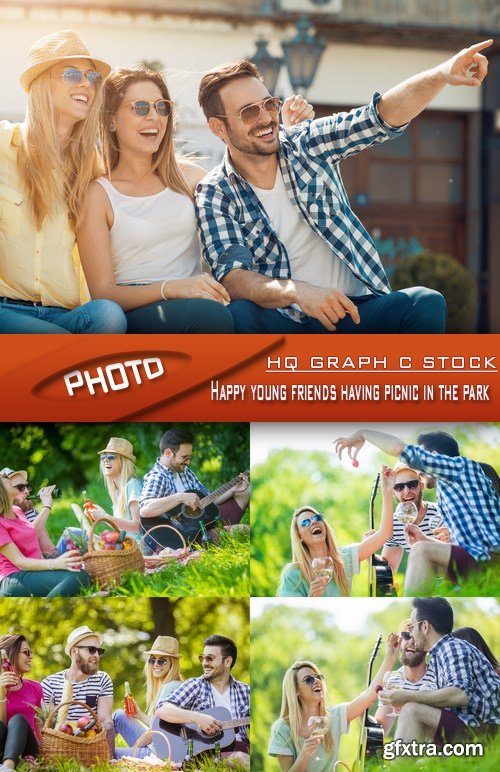 Stock Photo - Happy young friends having picnic in the park