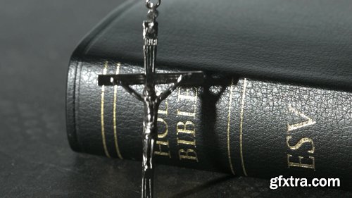 Rosary Beads Falling Onto a Bible Rosary Beads Falling Onto a Bible