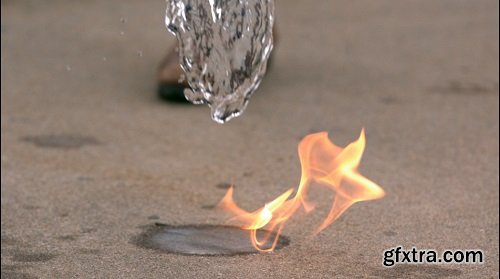 Slow motion pouring water onto fire