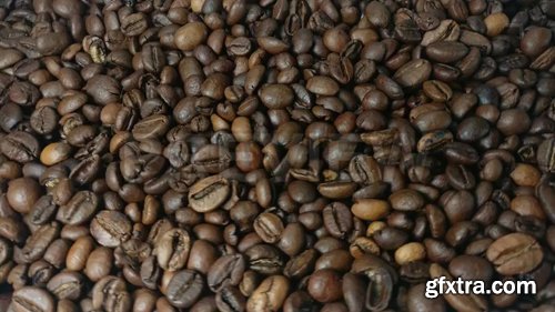 MA - Falling and rotation roasted coffee beans in slow motion MA - Falling and rotation roasted coffee beans in slow motion