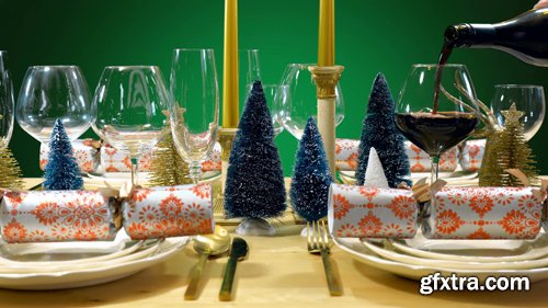Festive Christmas lunch table in modern gold, copper, and white theme against a green background Festive Christmas lunch table in modern gold, copper, and white theme against a green background
