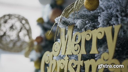 New-year decorative Christmas tree decorated with golden toy decorations New-year decorative Christmas tree decorated with golden toy decorations