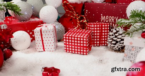 Background video with Christmas ornaments and gift box and snow Background video with Christmas ornaments and gift box and snow