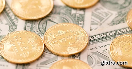 Bitcoin on US paper banknote in rotation Bitcoin on US paper banknote in rotation