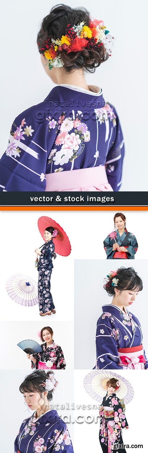Geisha in kimono with an umbrella and fan and flowers in hair
