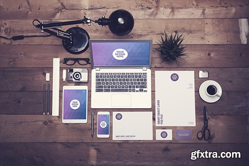 Laptop, Tablet, Smartphone, and Stationery on Dark Wooden Desk 124670228