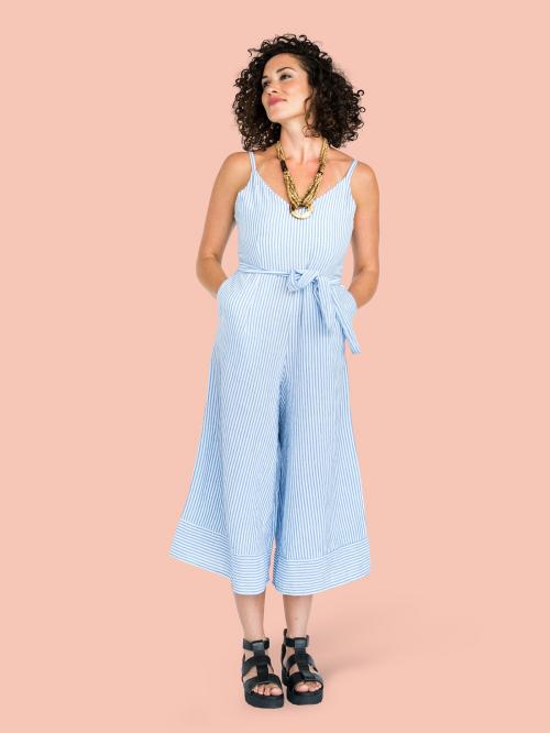 Woman in a blue jumpsuit character isolated on pastel pink background - 591370