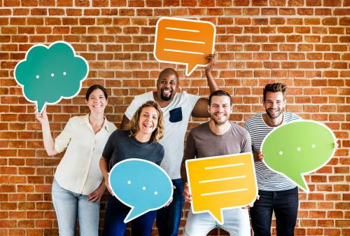 Diverse happy people holding speech bubble icons - 537883