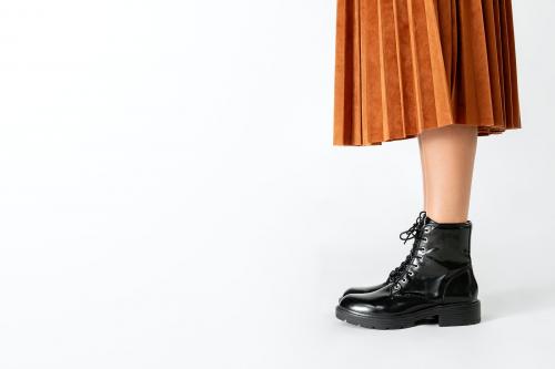 Woman in a skirt wearing combat boots - 2283348