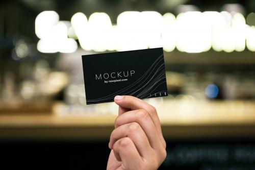 Female hand holding a black business card mockup - 502992