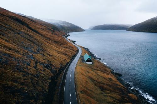 Scenic country road by the lake on Faroe Islands background - 2208658