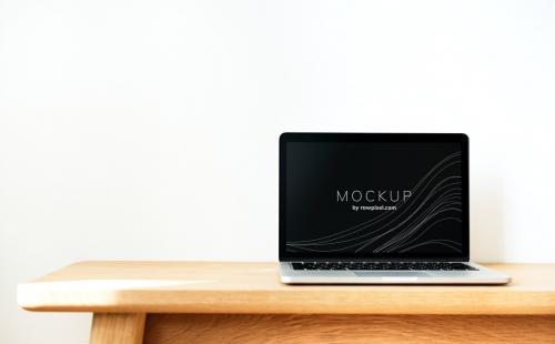 Laptop screen mockup on a wooden table - 502826