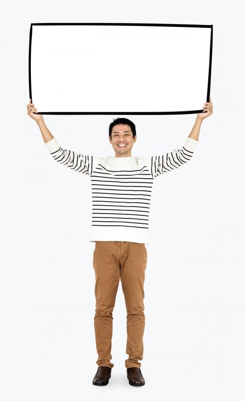 Cheerful man showing a blank white banner - 491292
