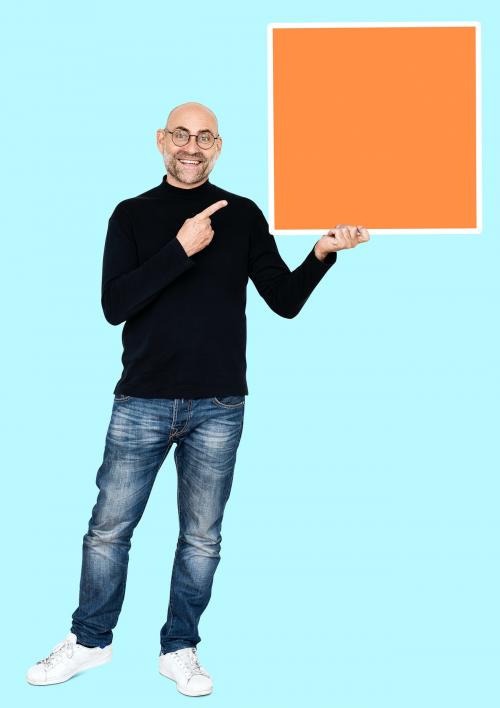 Happy man holding an orange square shaped board - 492169