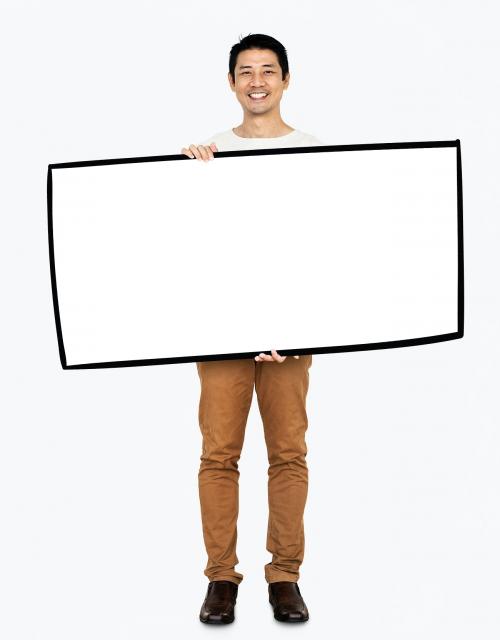 Cheerful man showing a blank white banner - 490979