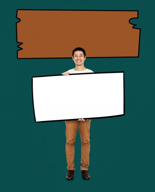 Cheerful man showing a blank white banner - 491082