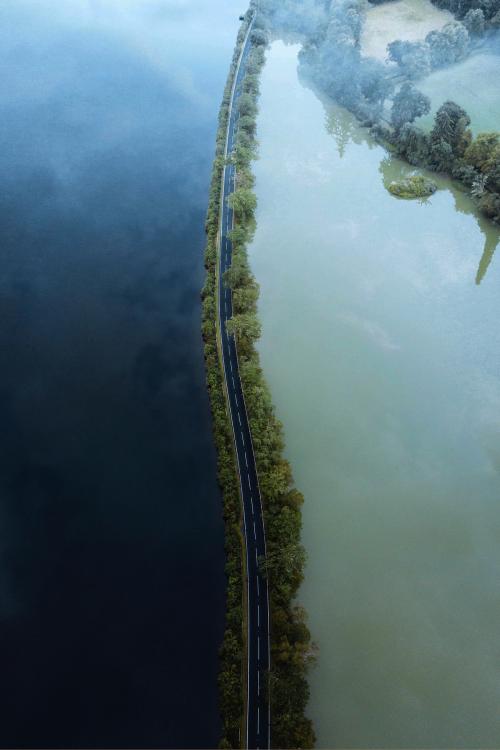 Road on a lake drone shot - 1230514