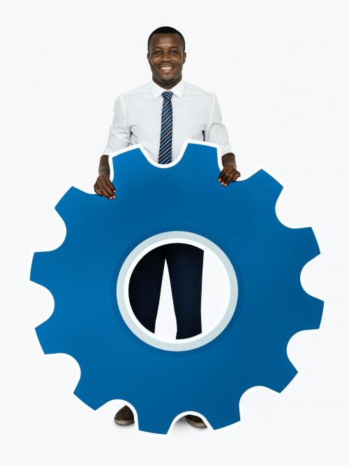 Businessman holding a cogwheel icon - 468483
