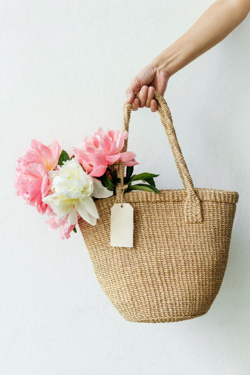 Beautiful peonies in a wicker bag - 1207617