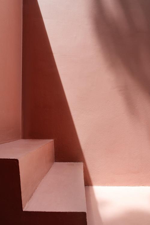 Steps by a pink wall with shadows - 1212783