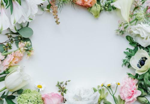 Fresh flowers frame on a white background - 1207758