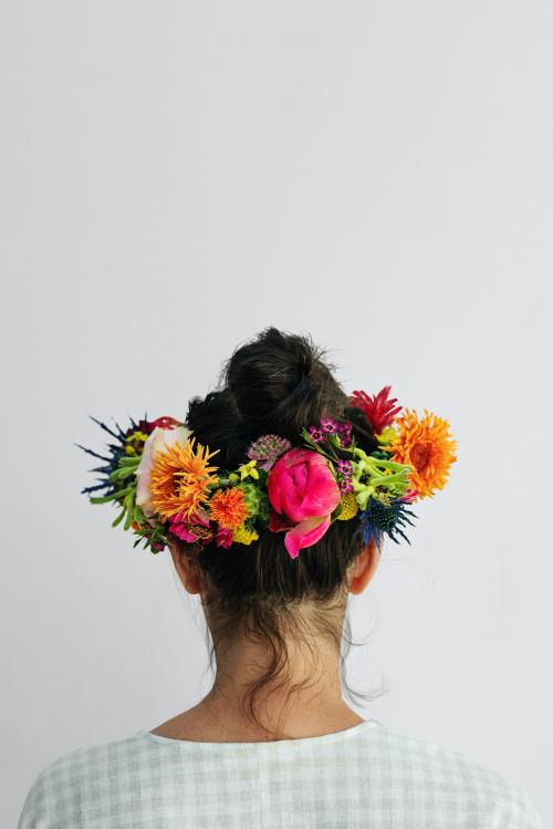 Beautiful woman with a midsummer floral wreath - 1207293