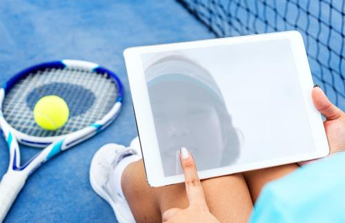 Reflection of a female tennis player on tablet screen mockup - 5764
