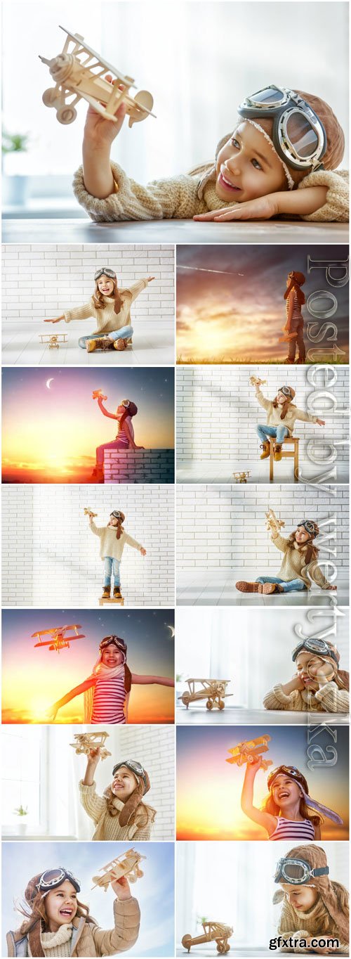 Cheerful little girl with airplane stock photo Cheerful little girl with airplane stock photo