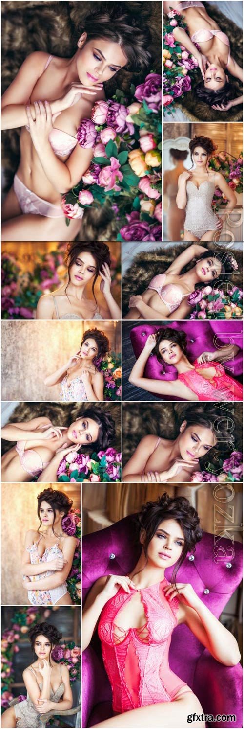Girl in lingerie among flowers stock photo