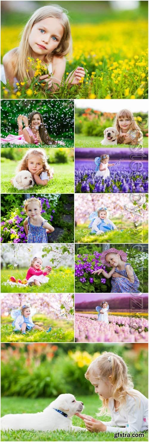 Little girls in flowers stock photo